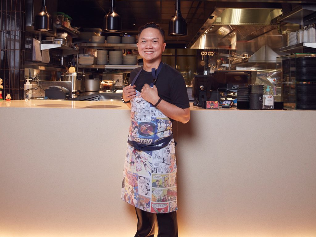 Reif Othman to host Time Out Market Dubai dinner: Time Out Market Dubai launches exclusive Chef’s Edition dining series, Chef Reif posing in kitchen in a colourful apron