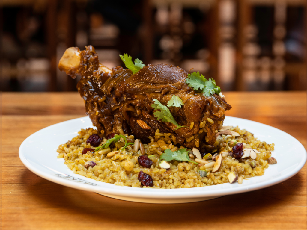 Time Out Market Dubai Ramadan: Reif Lamb shank wiht rice on a wooden table