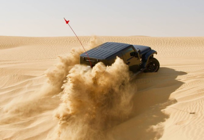 UAE off-roading clubs Desert Hawks jeep in sand dune