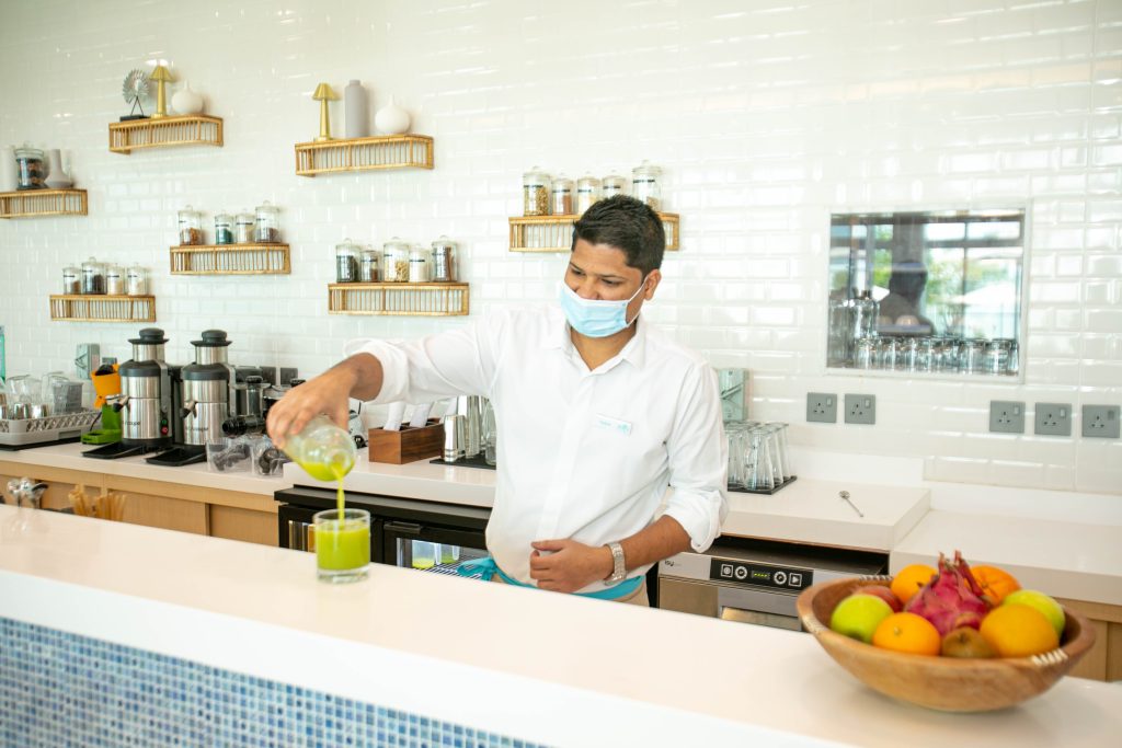 Zoya health and wellbeing resort: waiter pouring green juice at bar