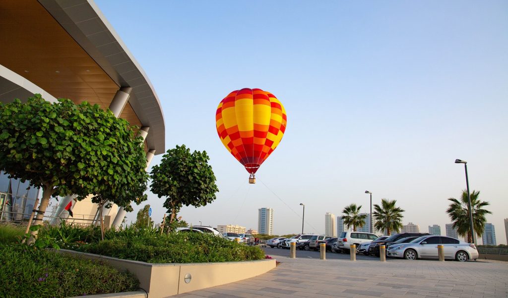 Ras Al Khaimah hot air balloon ride: hot air balloon ride in sky over parking lot